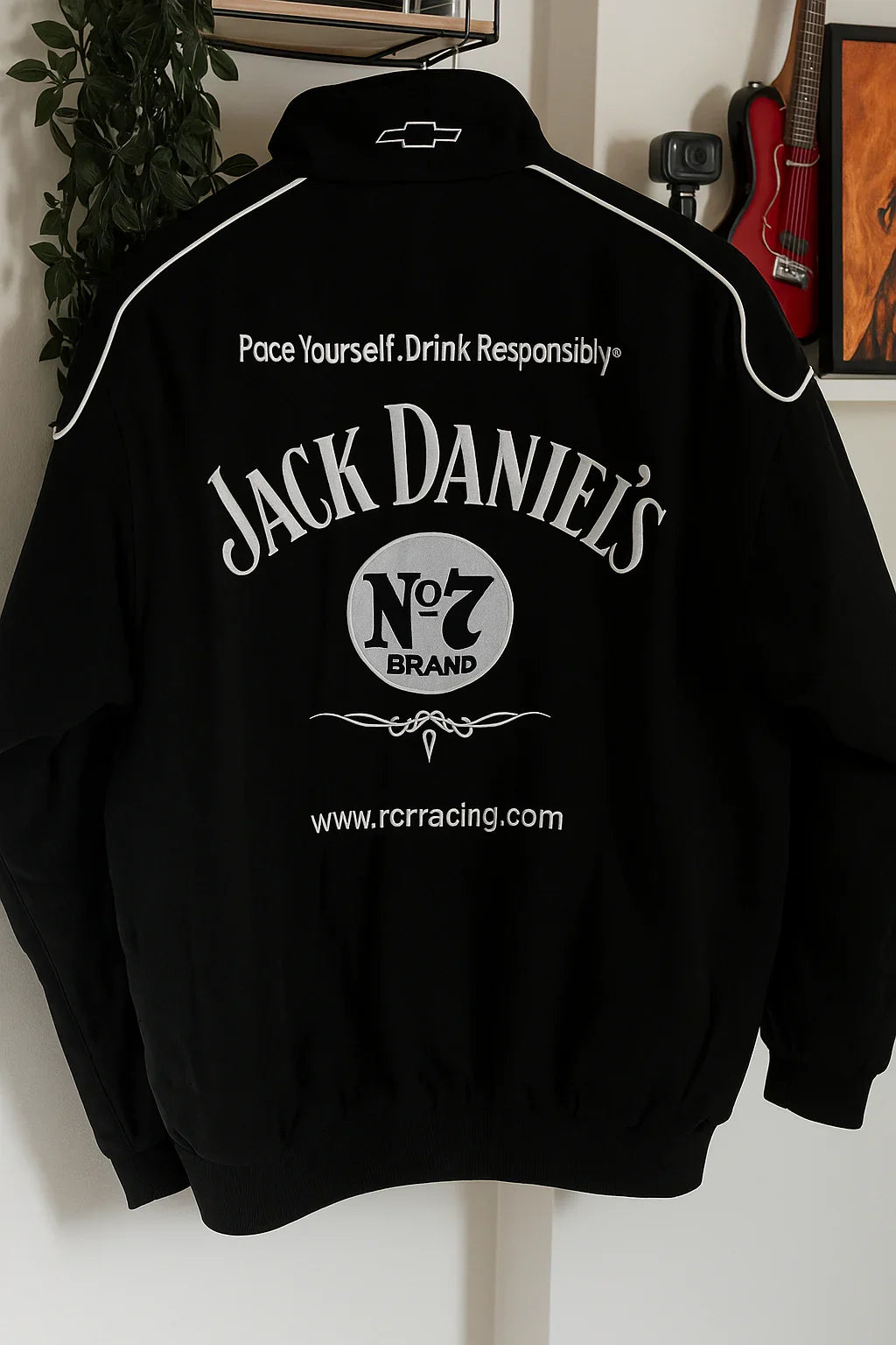 Black streetwear jacket with Jack Daniel's No.7 branding and racing details on the back.