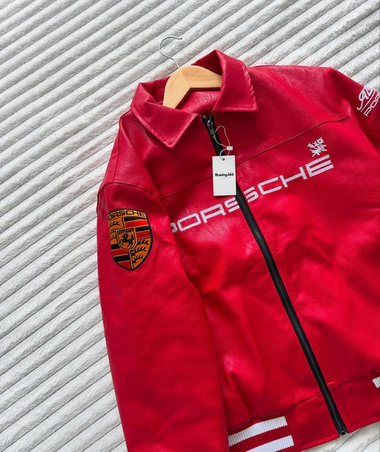 Red faux leather jacket with Porsche logo, black zipper, and embroidered patches on sleeve