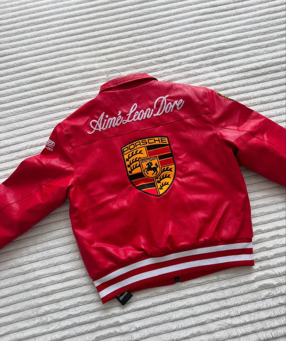 Red streetwear jacket with large Porsche logo and bold embroidered lettering on the back