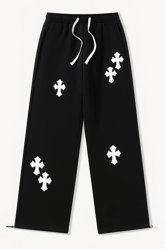Black streetwear track pants with white cross motifs and drawstring waist
