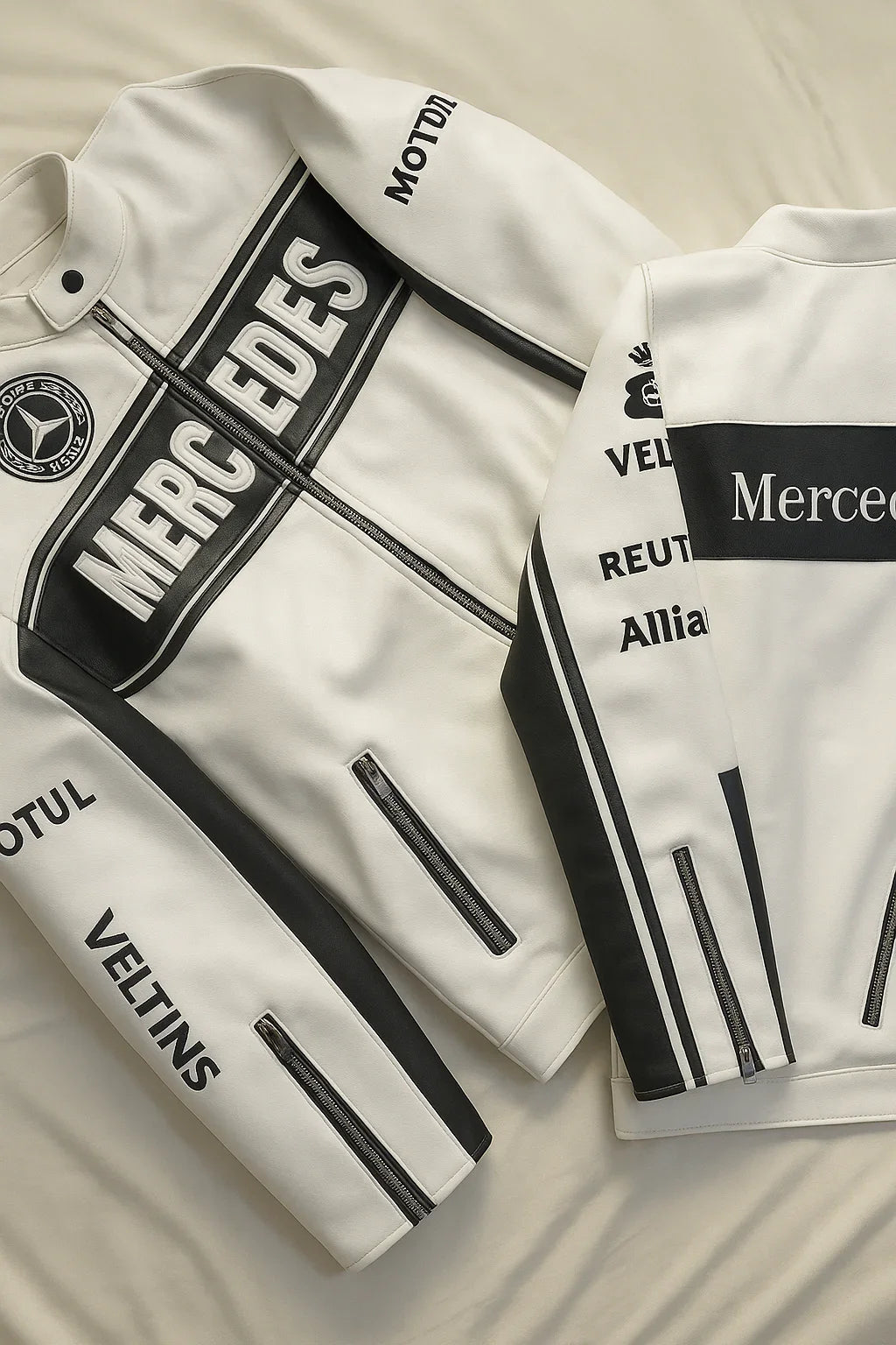 White and black varsity jackets with bold lettering, zippered pockets, and racing-inspired patches.